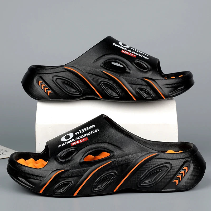 Men's EVA sliders with nubbed footbed, wide vented band and thick sole - black/orange
