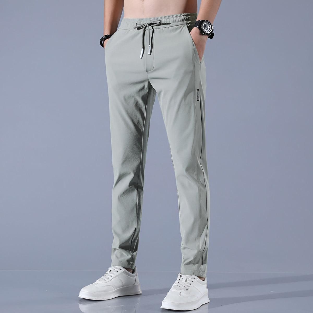 Men's waterproof stretch golf trousers in green, front view