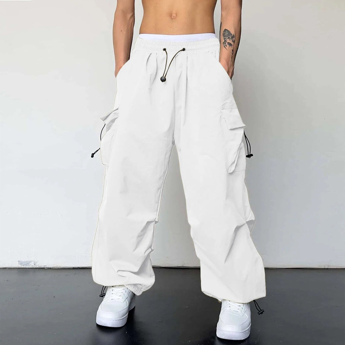 Men's wide-leg cargo trousers with a drawcord waist, flap pockets and adjustable ankles - white