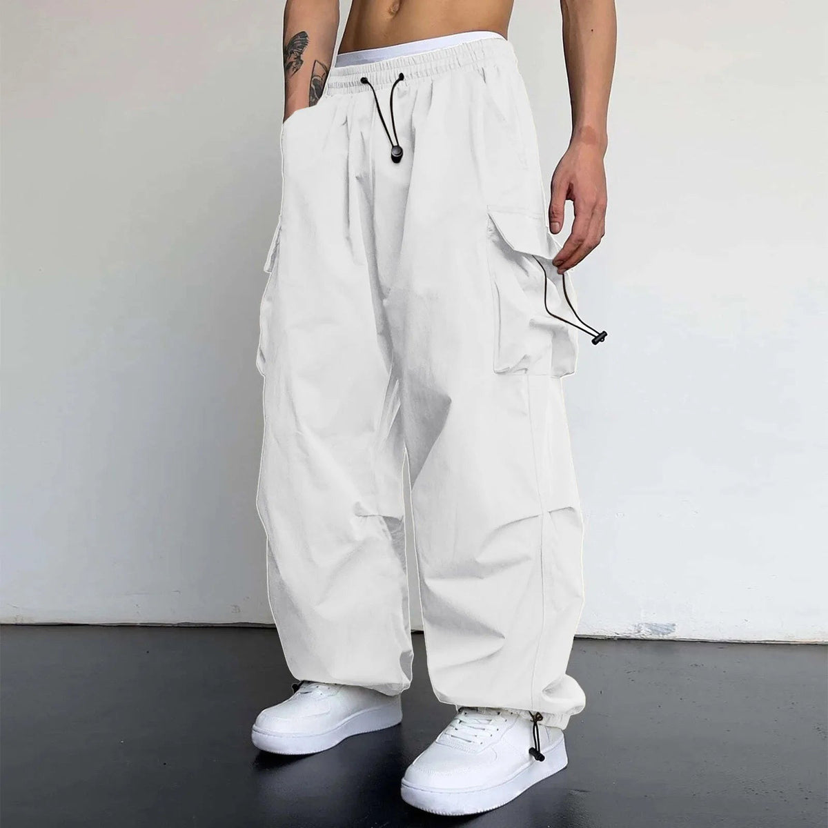 Men's wide-leg cargo trousers with a drawcord waist, flap pockets and adjustable ankles - view 2