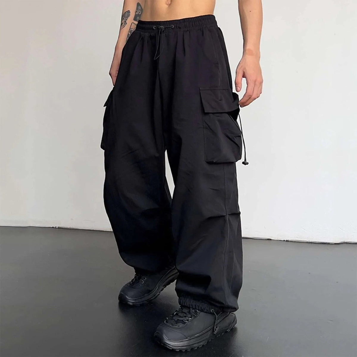 Men's wide-leg cargo trousers with a drawcord waist, flap pockets and adjustable ankles - view 9