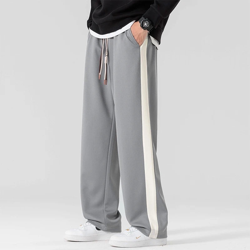 Men's wide-leg joggers with a wide contrast stripe along the outer seam and a drawcord - grey