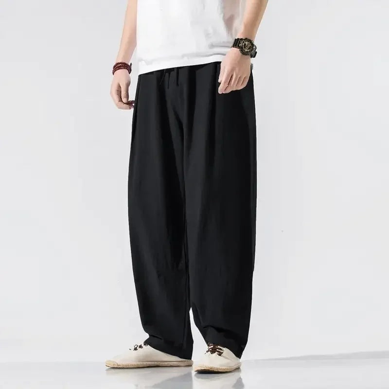 Men's wide-leg linen blend trousers with an elasticated drawstring waist and pleats - black