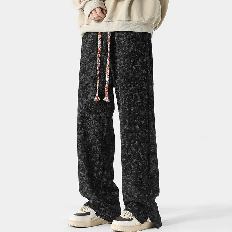 Men's wide-leg trousers with a washed mottled print, braided drawcord and split hems - black
