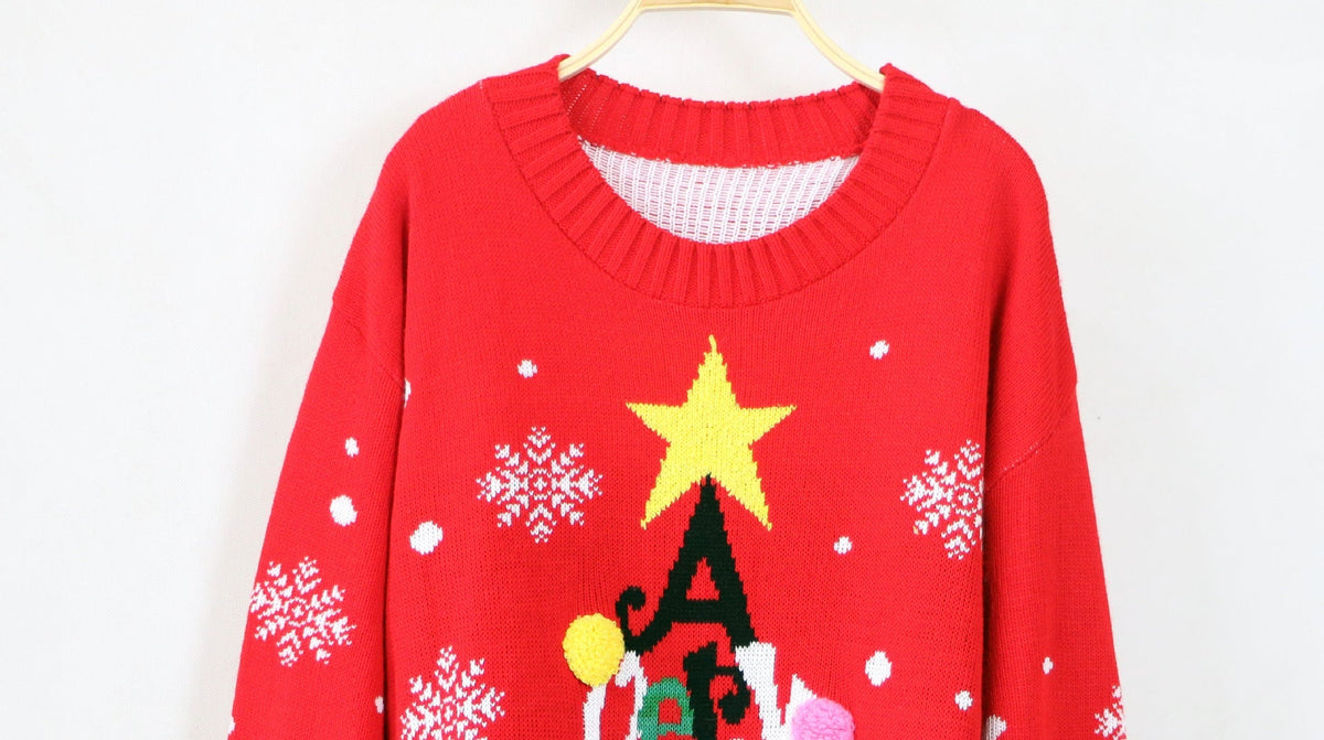 Women's knitted Christmas jumper with a Merry Christmas tree, star and pompoms