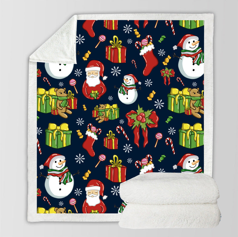 Christmas throw with a printed festive scene and a white teddy lining - navy with presents