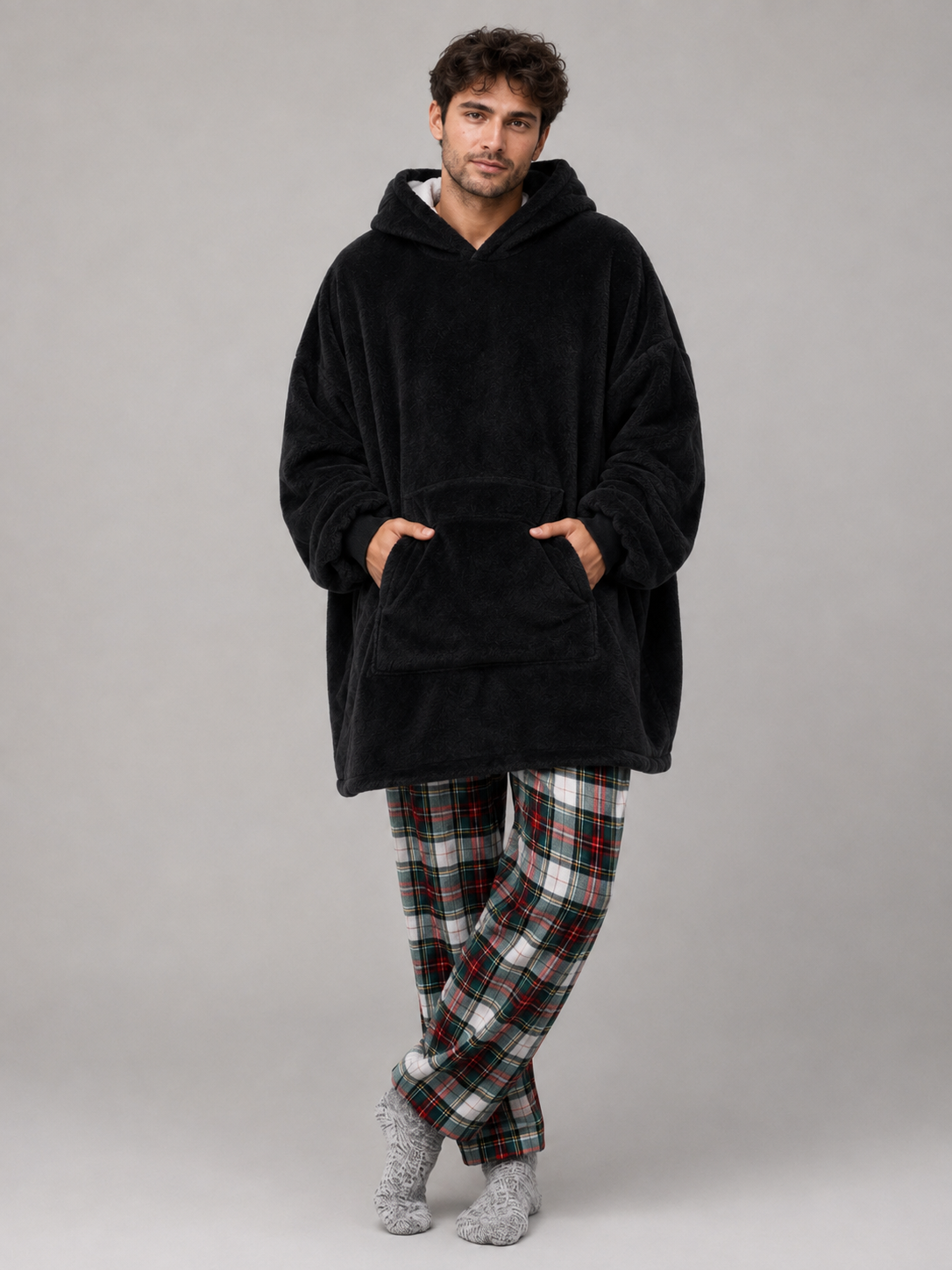 Oversized black blanket hoodie with a lined hood and full width pocket