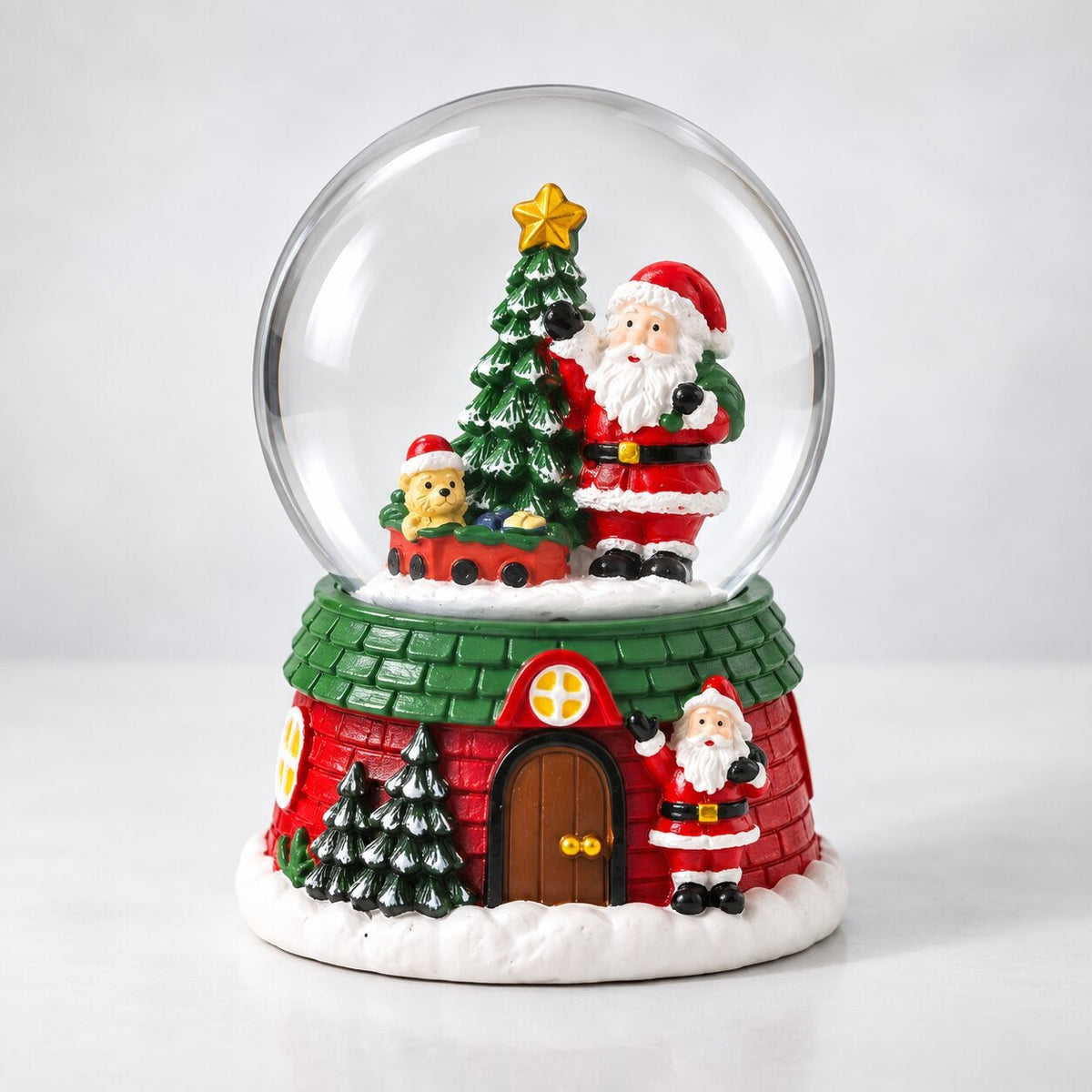 Musical glass snow globe with Santa on a Christmas house base - santa with toy train