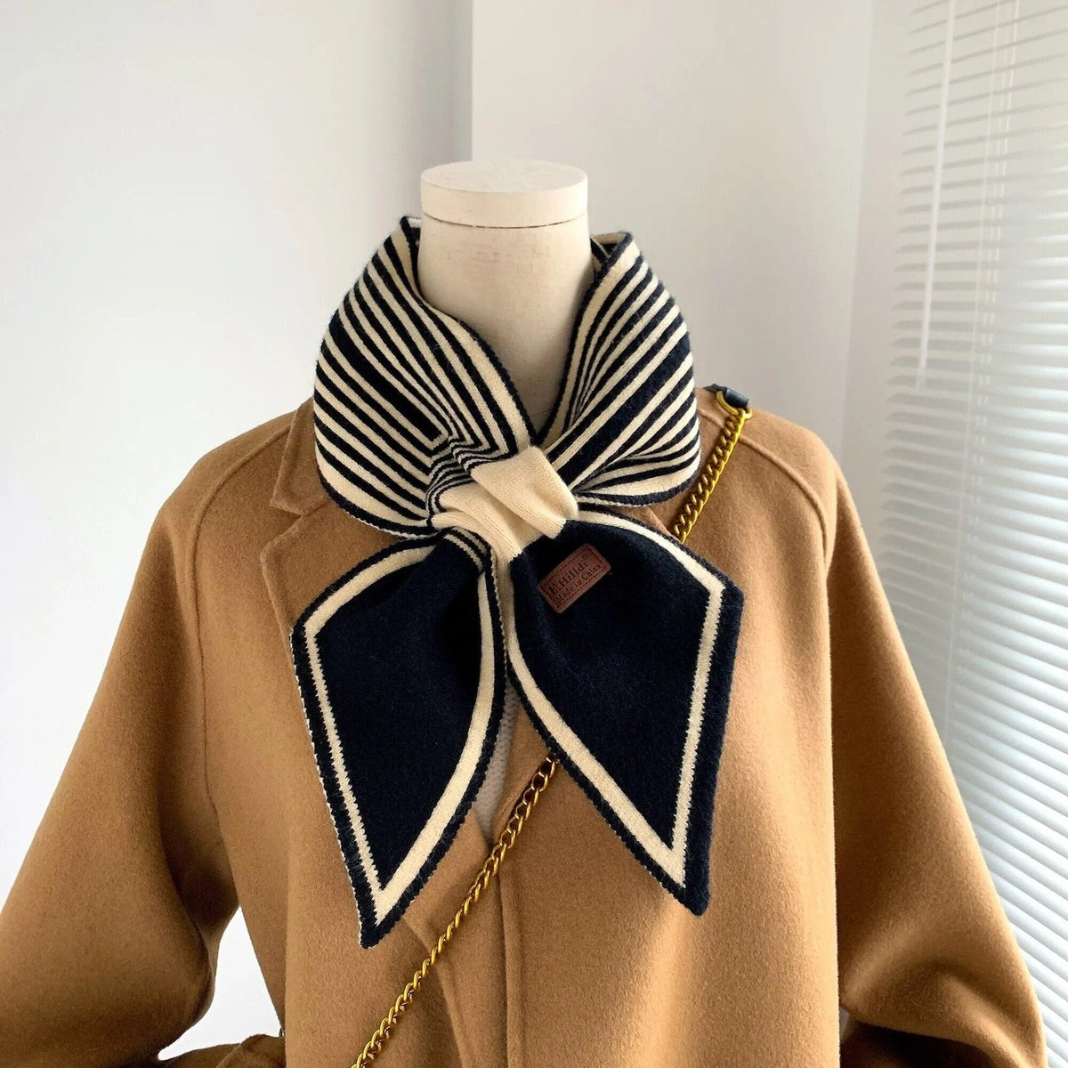 Women's narrow knitted scarf slipped through a small loop, with two plain pointed ends - stripe