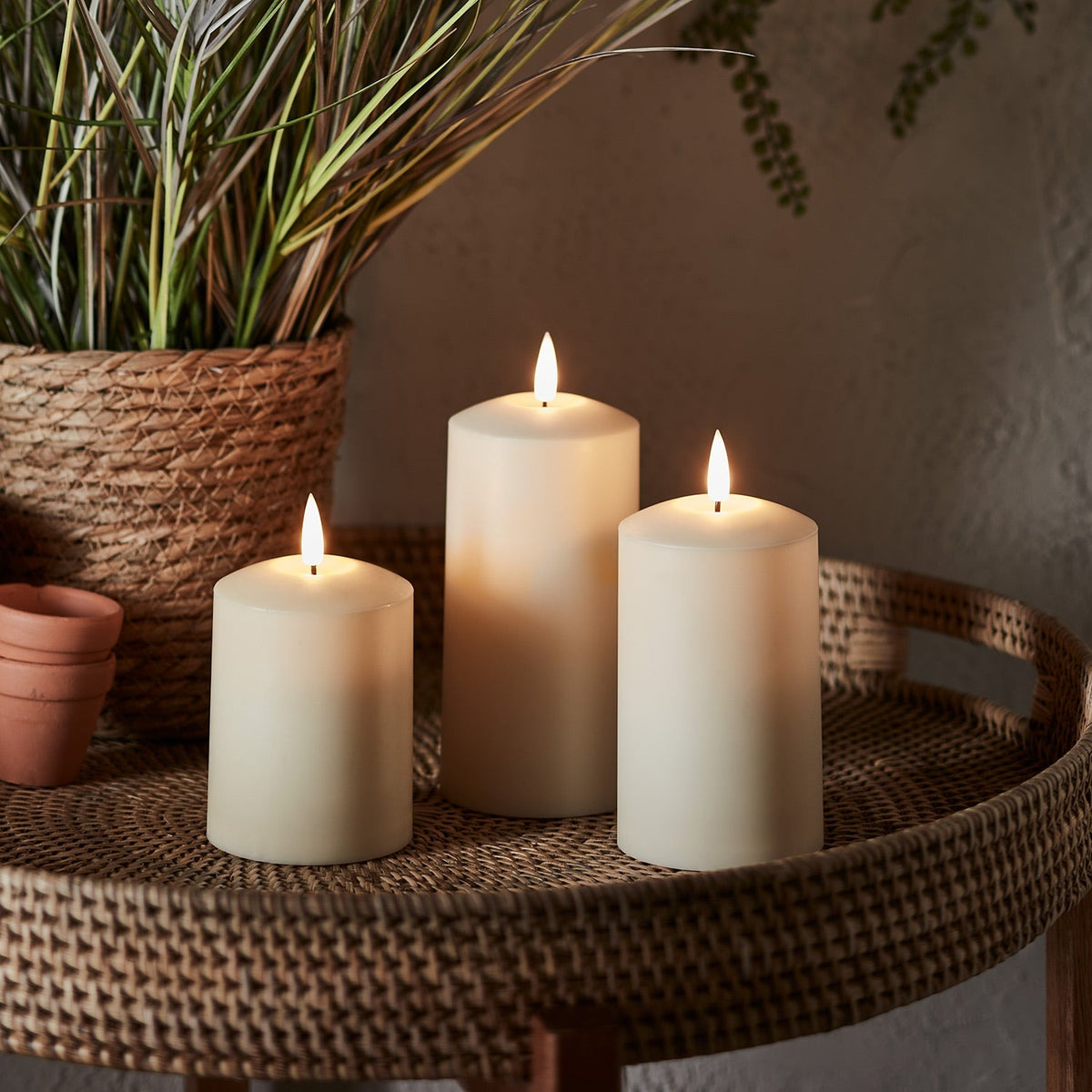 Three ivory outdoor LED candles with a flickering flame and timer - view 3