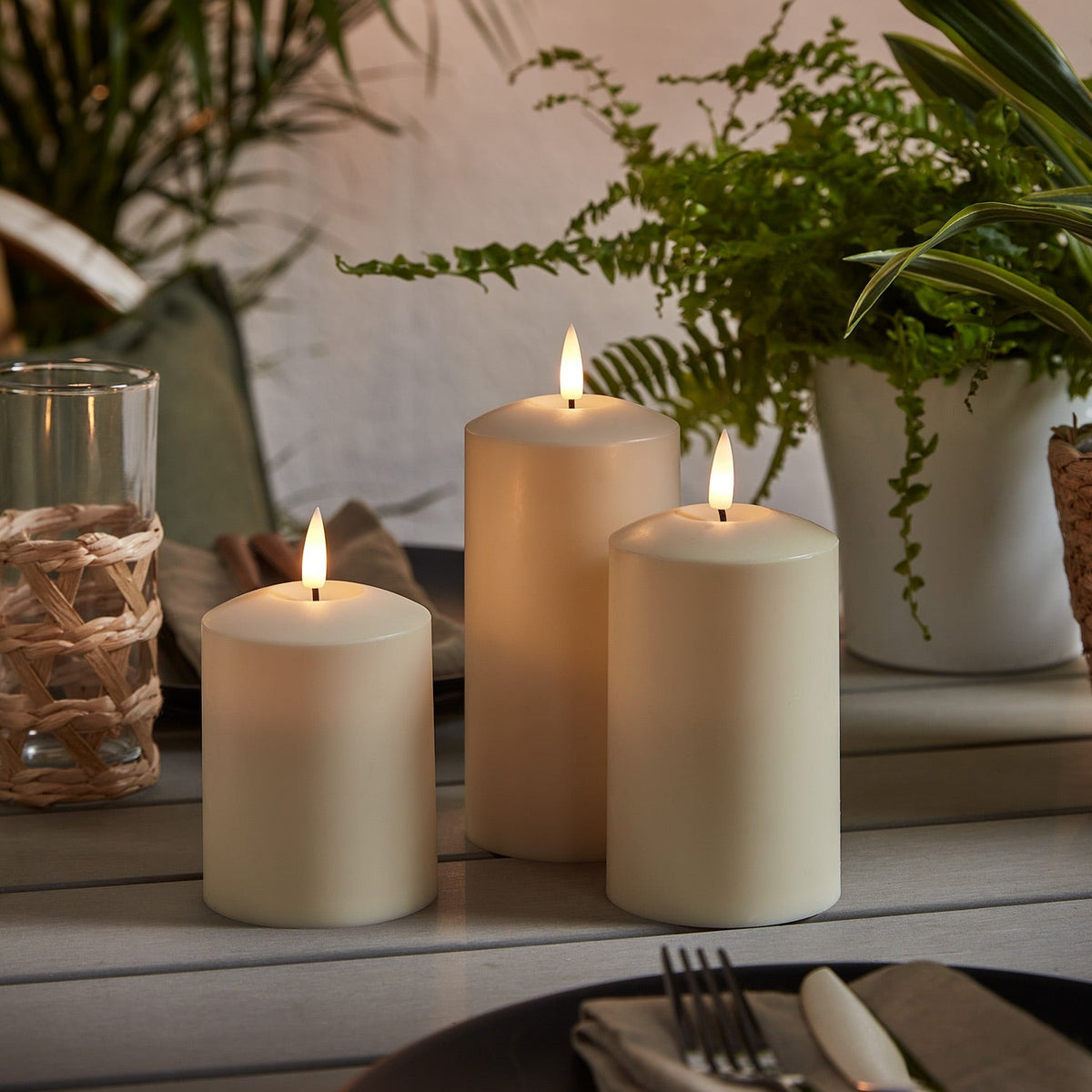 Three ivory outdoor LED candles with a flickering flame and timer - view 4