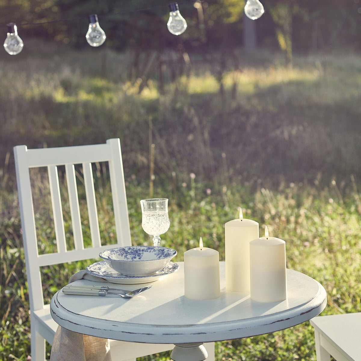 Three ivory outdoor LED candles with a flickering flame and timer - view 7