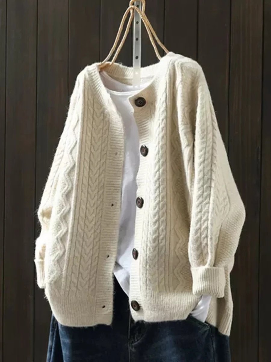 Women's oversized cable knit cardigan with a crew neck and button front - cream