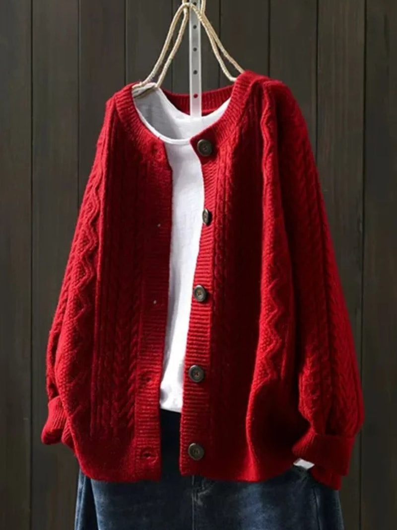 Women's oversized cable knit cardigan with a crew neck and button front - red
