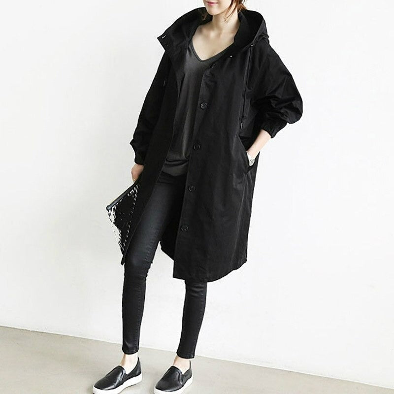 Women's oversized hooded trench coat with a button front - black