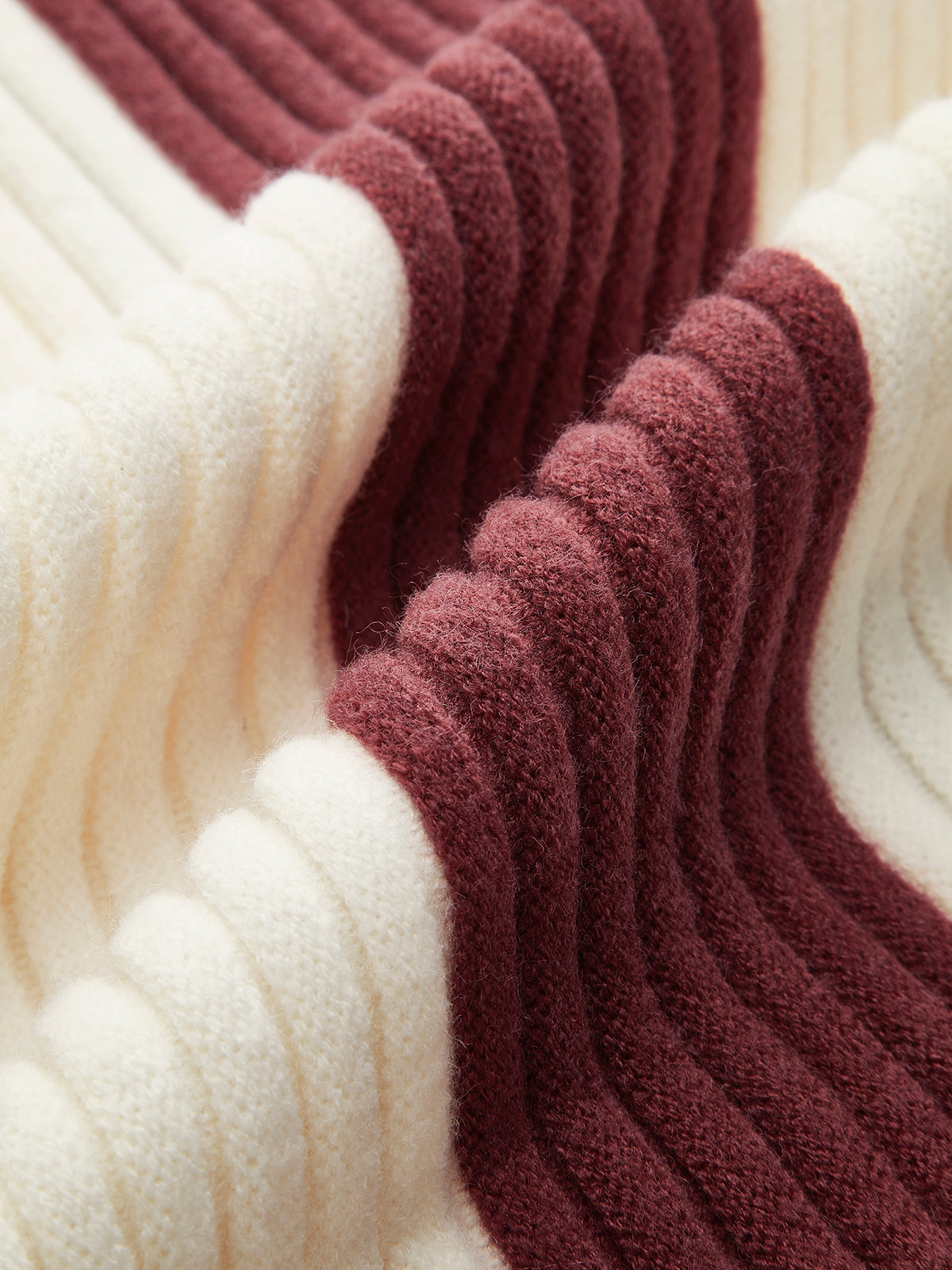 Women's oversized roll neck jumper with vertical colour blocks in chunky rib