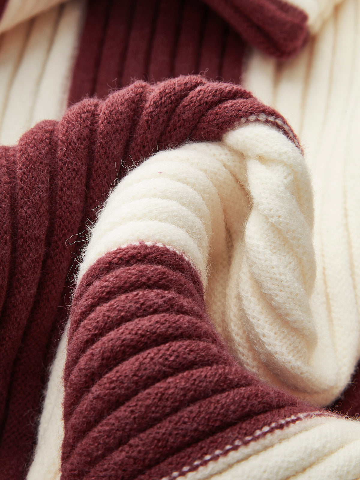 Women's oversized roll neck jumper with vertical colour blocks in chunky rib