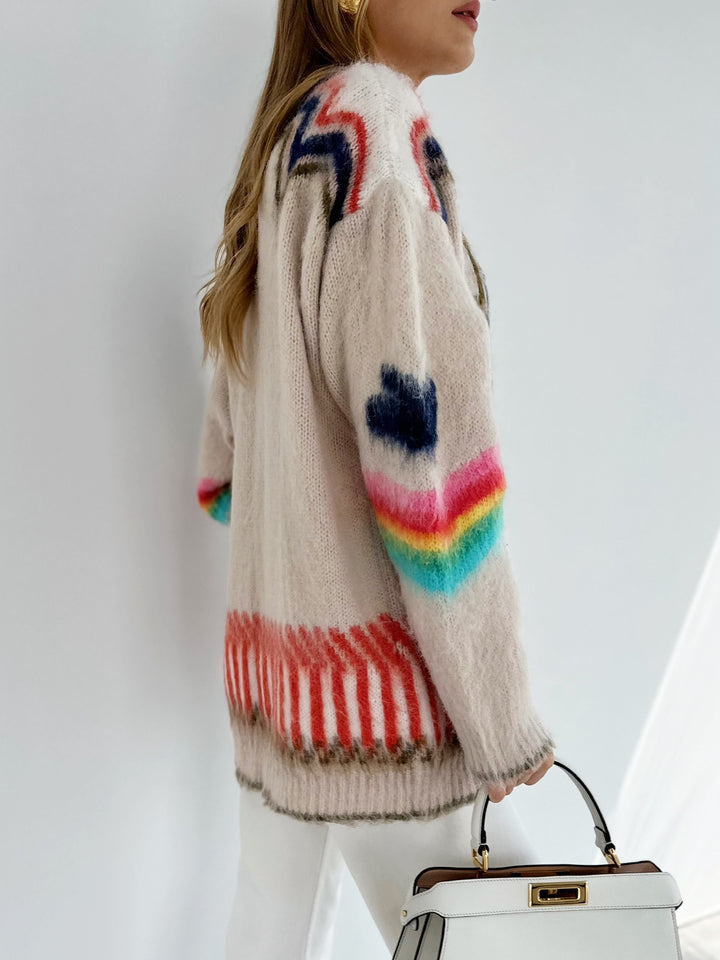 Women's oversized cardigan with a knitted star pattern, V-neck and patch pockets