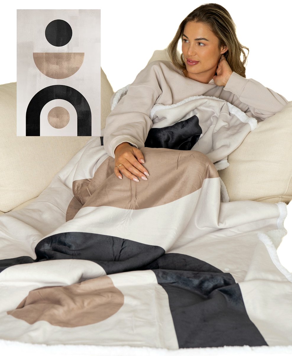 Sherpa throw blanket with a snap-on foot pocket in beige & black