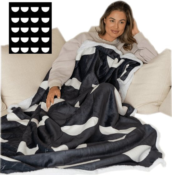 Sherpa throw blanket with a snap-on foot pocket in black & white