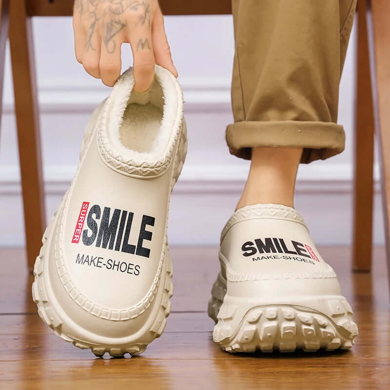 Platform slippers with a water-repellent shell, plush lining and chunky lug sole