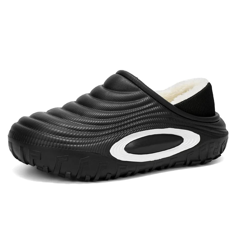 Platform slippers with a ridged shell, oval side detail, plush lining and lug sole - black