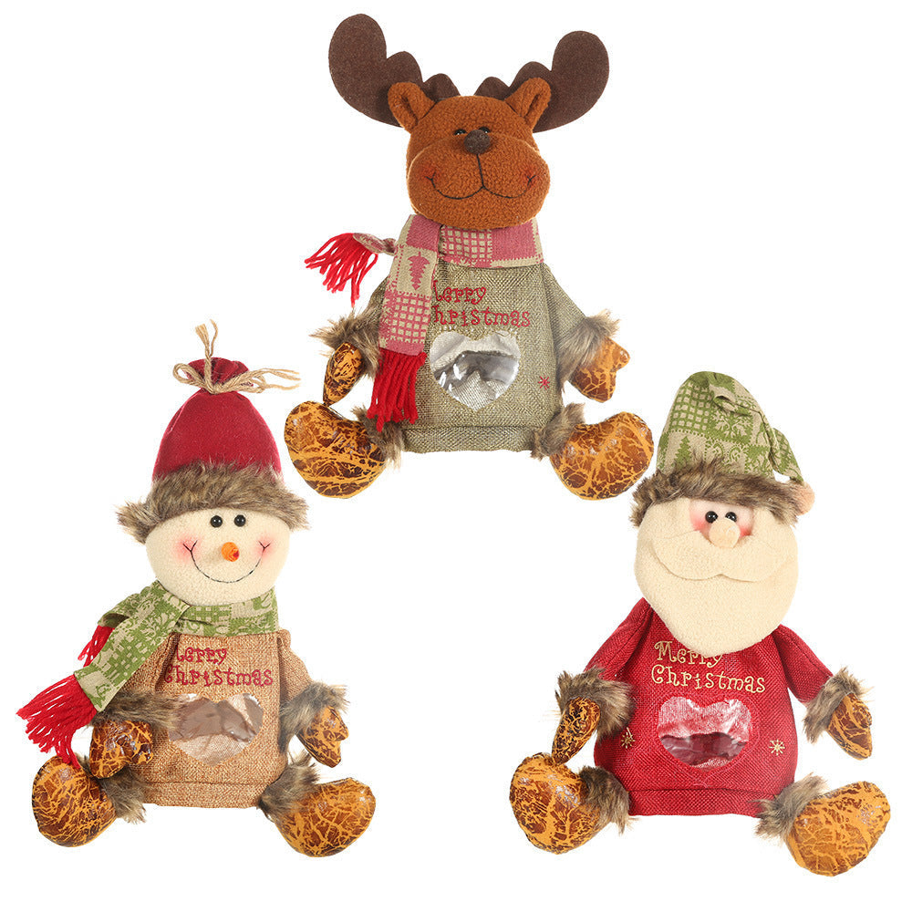 Seated plush Christmas figure with hat, scarf and a heart-shaped window in the body