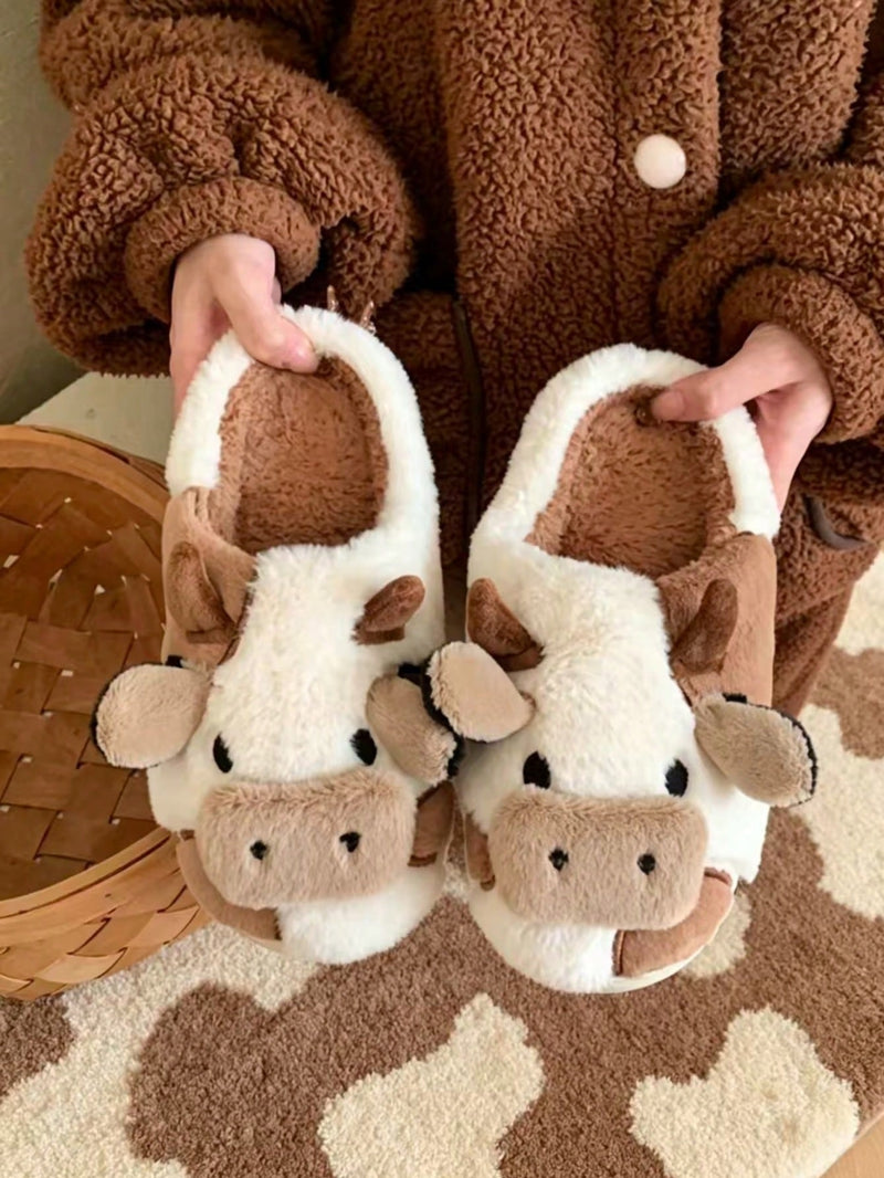 Plush cow slippers with little horns, ears and a snout on the toe and spots on the sides - brown/white