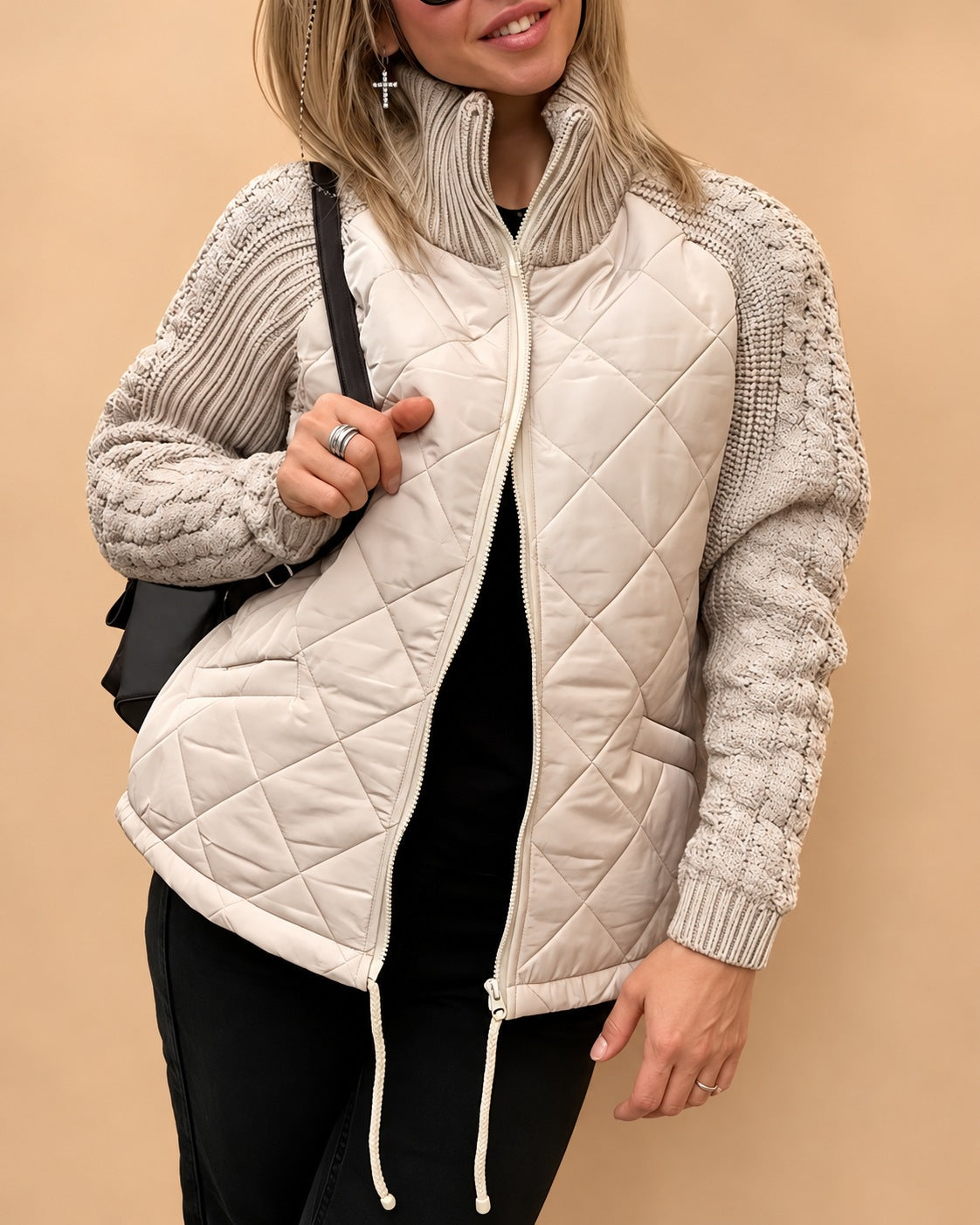 Women's quilted jacket with cable knit sleeves and a high collar - cream