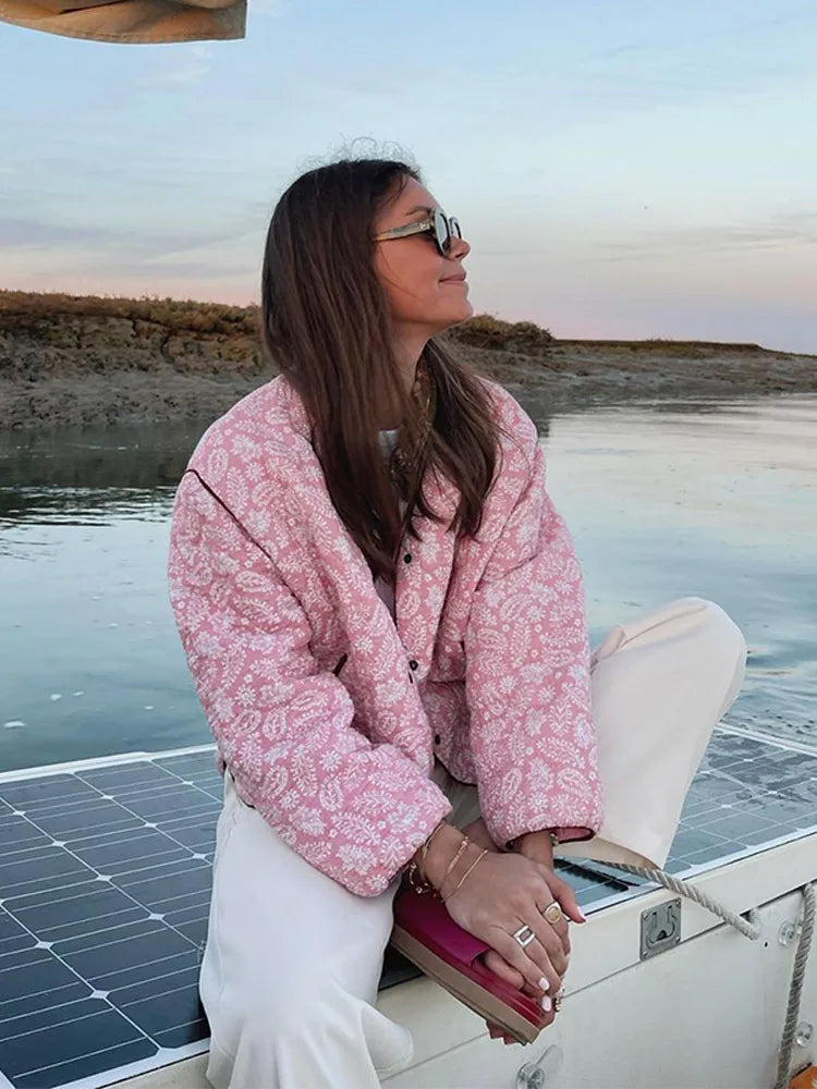 Women's collarless quilted jacket with a paisley print and burgundy piping