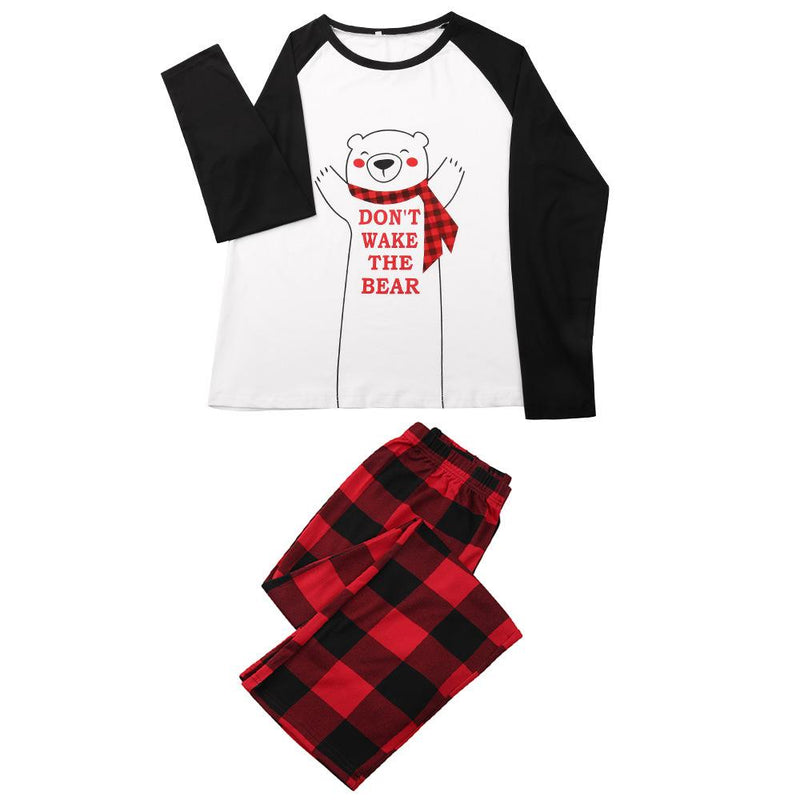 Family Christmas pyjamas with a polar bear slogan top and red and black check bottoms