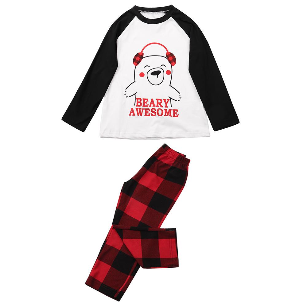 Family Christmas pyjamas with a polar bear slogan top and red and black check bottoms