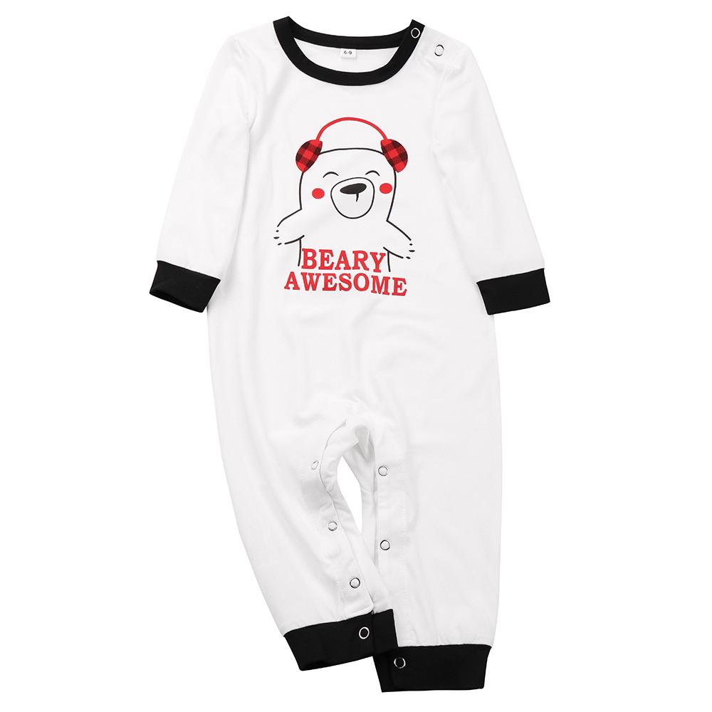 Family Christmas pyjamas with a polar bear slogan top and red and black check bottoms