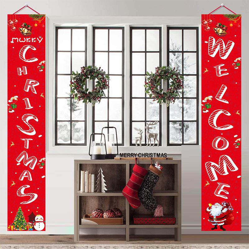 Set of two red Christmas porch banners, 180 x 30 cm, beside a front door