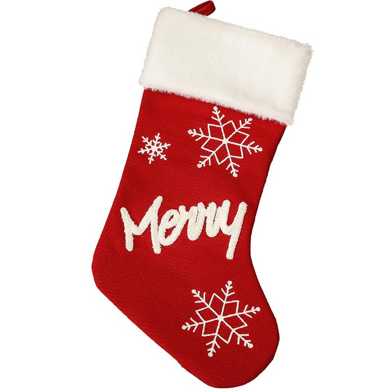 Red Christmas stocking with a white plush cuff, snowflakes and lettering - merry