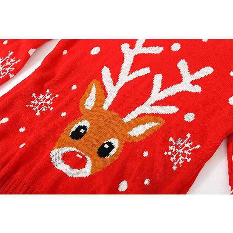 Women's red knitted Christmas jumper with a reindeer face and snowflake sleeves