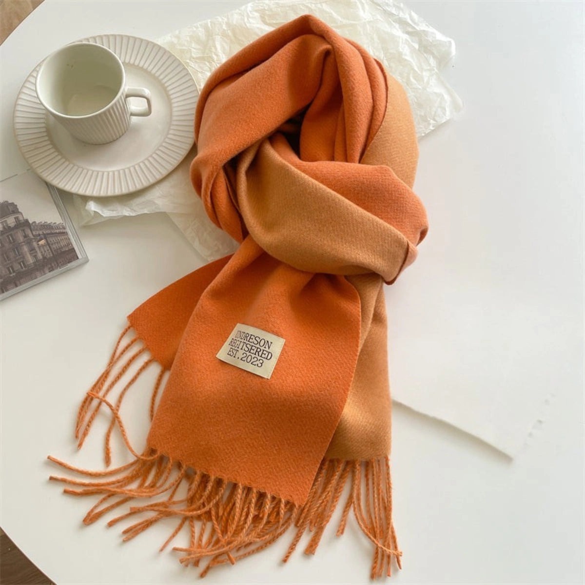 Women's reversible two-tone scarf with fringe and a small fabric label - orange