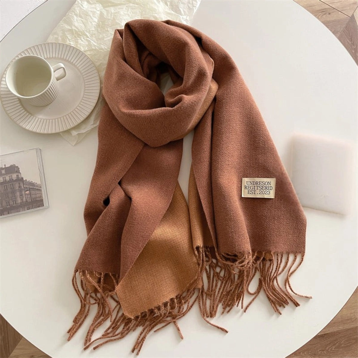 Women's reversible two-tone scarf with fringe and a small fabric label - rust brown