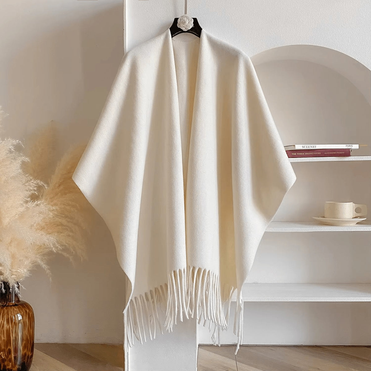 Reversible women's poncho in soft knit with fringe on a hanger - cream