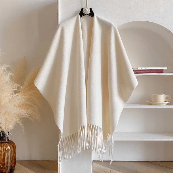 Reversible women's poncho in soft knit with fringe on a hanger - cream
