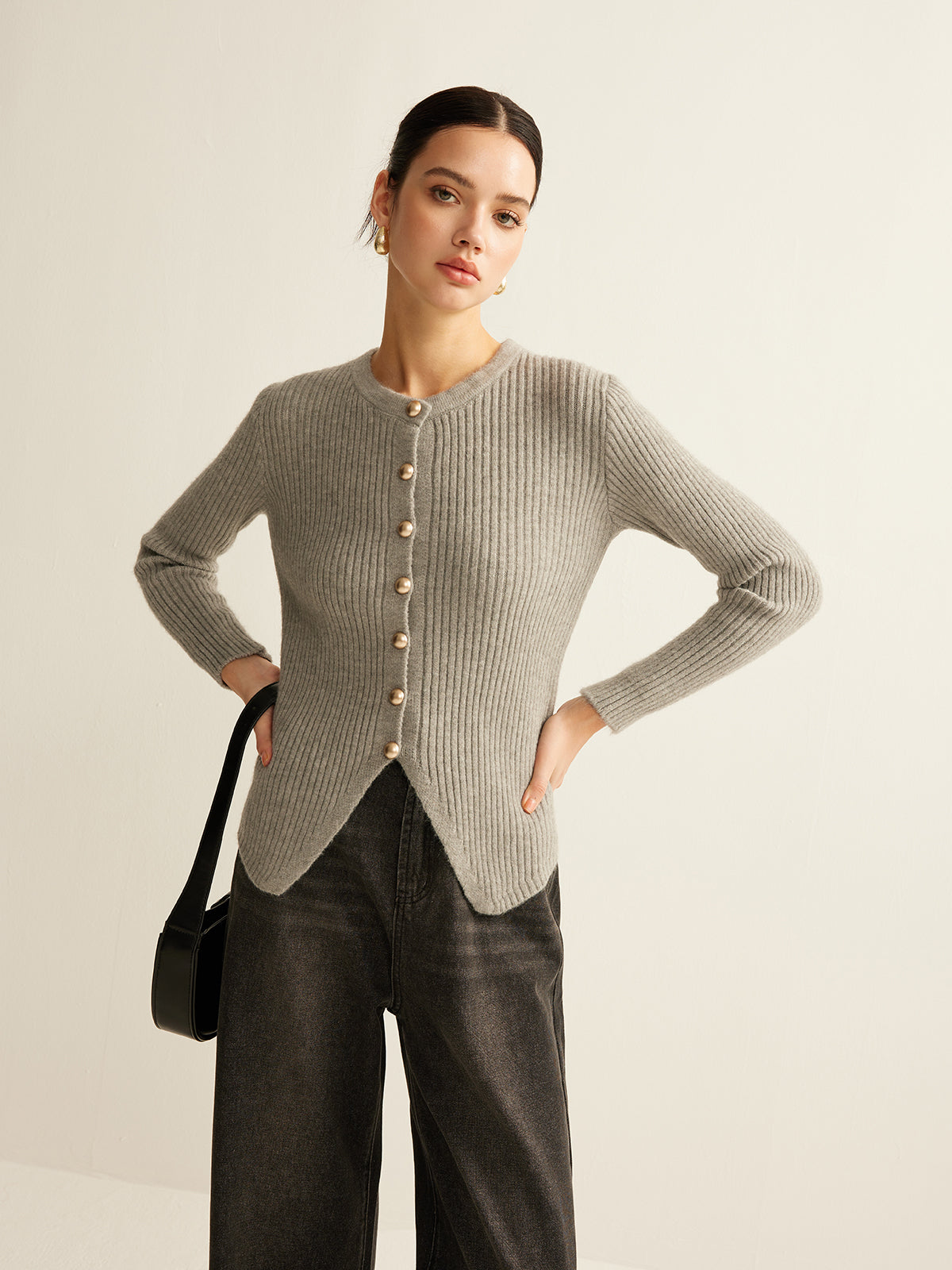 Women's ribbed crew neck cardigan with metal buttons and a scalloped hem