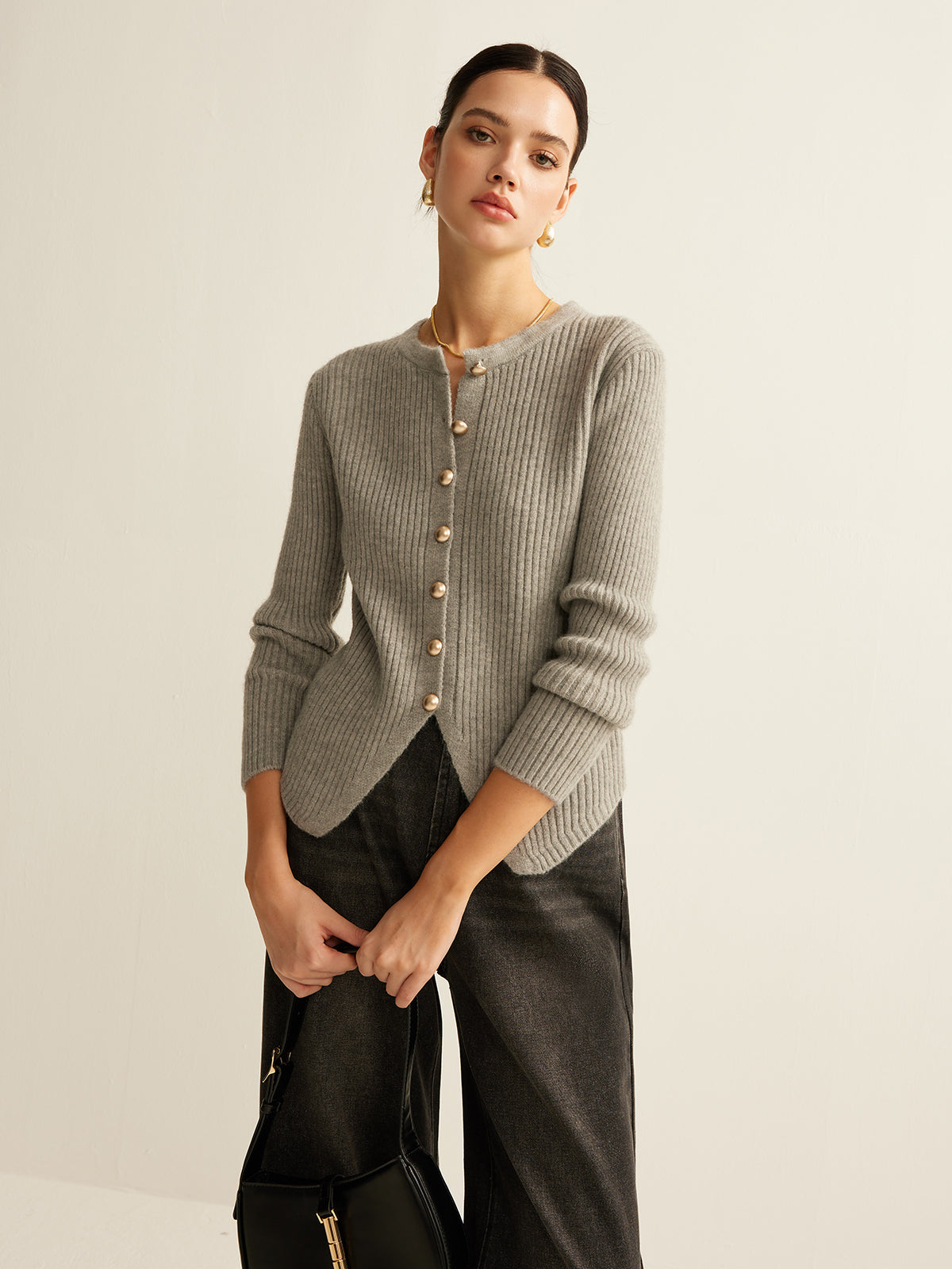 Women's ribbed crew neck cardigan with metal buttons and a scalloped hem