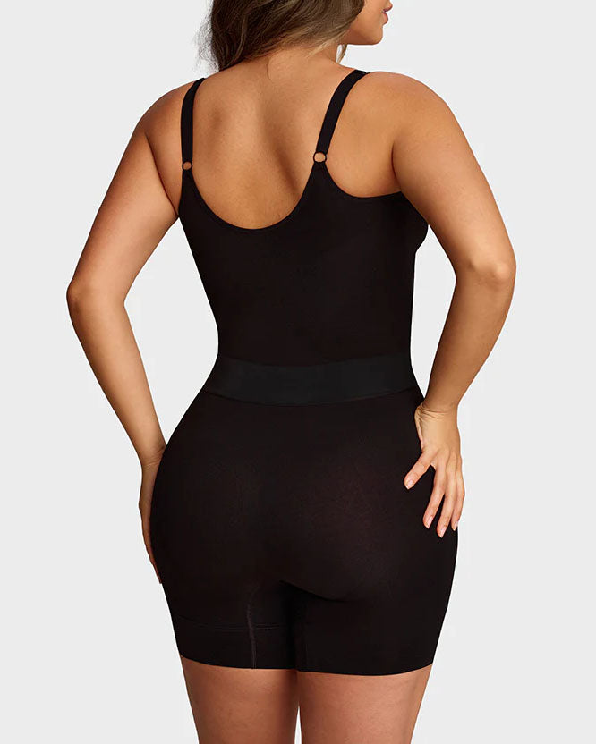 Seamless shapewear bodysuit with thin adjustable straps and legs to mid-thigh