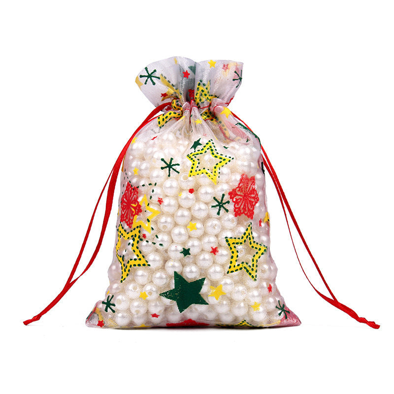 Sheer organza Christmas gift bags with red ribbon ties and festive print