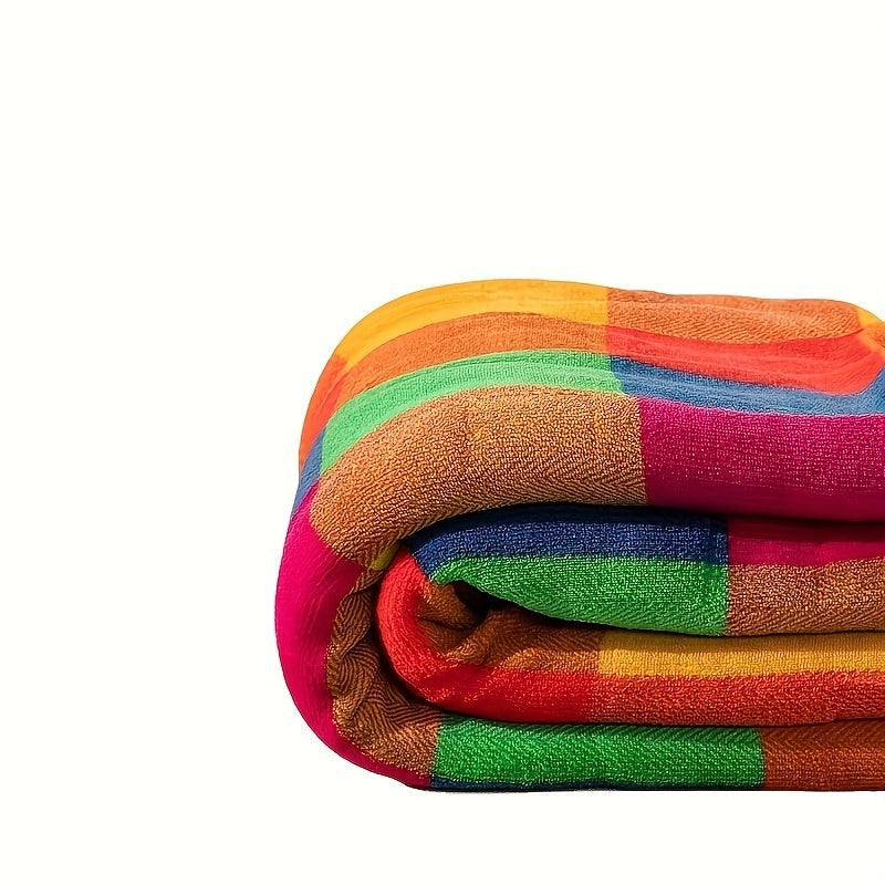 Sherpa throw with a colourful check pattern on a bed - view 5