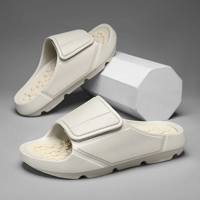 EVA sliders with a wide adjustable strap, a footbed of small nubs and a thick sole - view 2