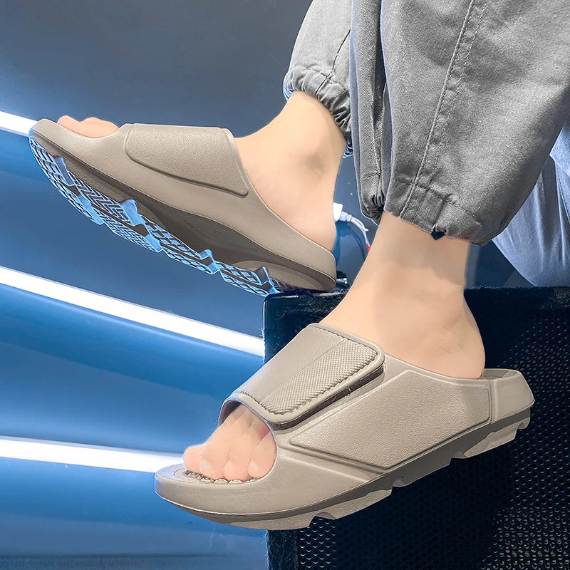 EVA sliders with a wide adjustable strap, a footbed of small nubs and a thick sole - view 6