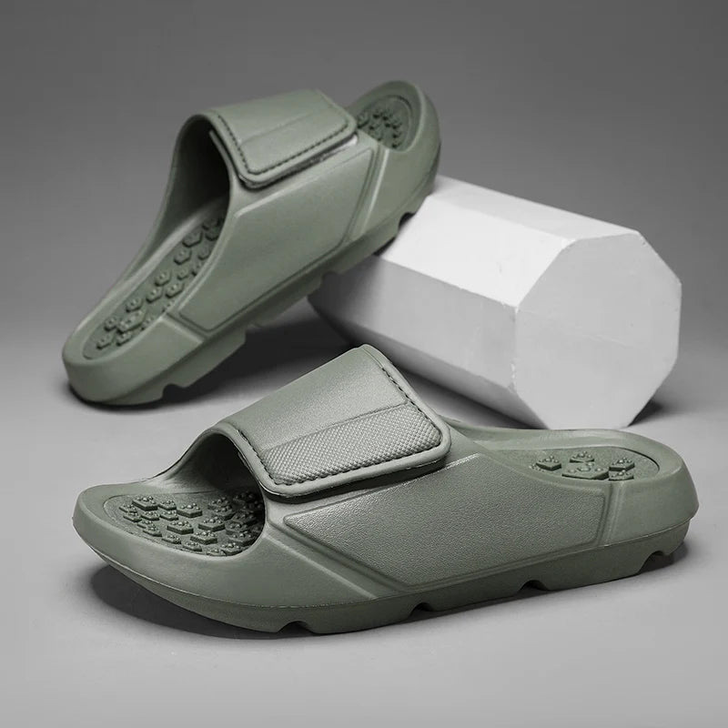 EVA sliders with a wide adjustable strap, a footbed of small nubs and a thick sole - green