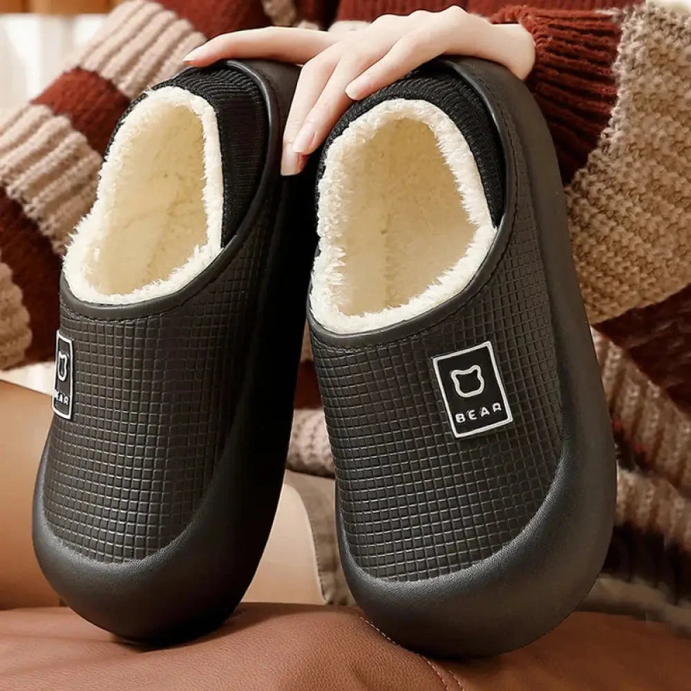 Slippers with a water-repellent grid-textured shell, plush lining and thick sole