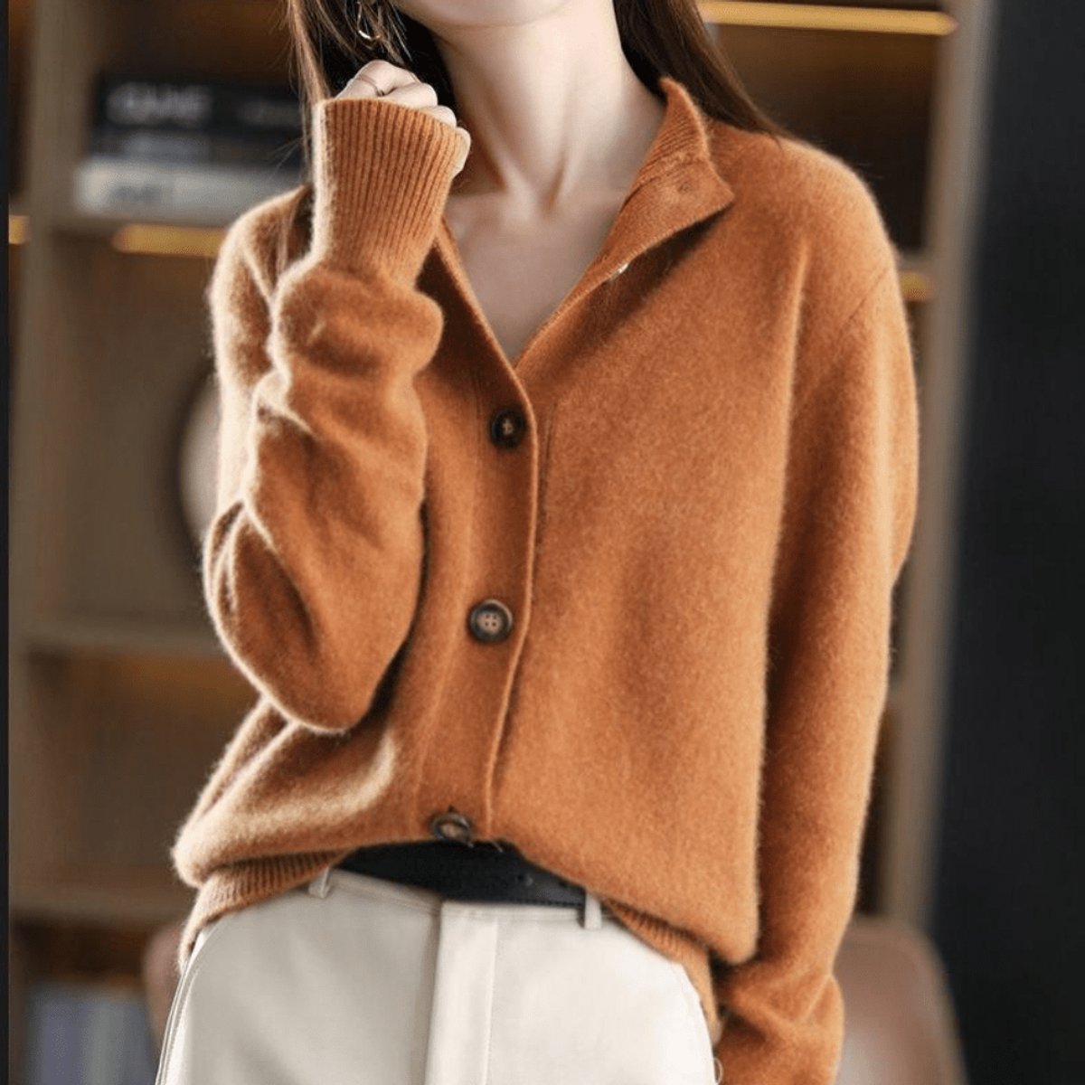 Women's soft knit cardigan with a convertible collar and brown buttons